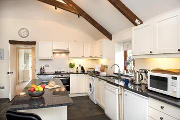 The stylish kitchen painted in Farrow and Ball colours with gorgeous granite work surfaces.