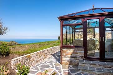 The conservatory and patio take full advantage of the view.