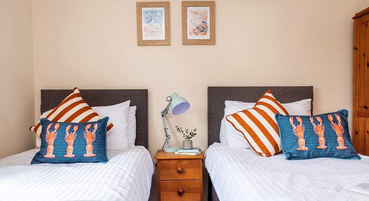 The seaside cushions and prints perfectly suit the coastal location.