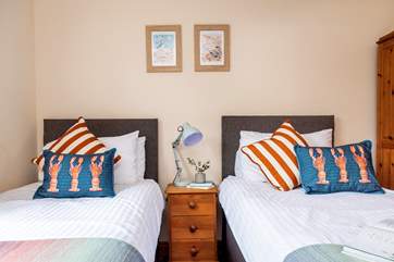The seaside cushions and prints perfectly suit the coastal location.