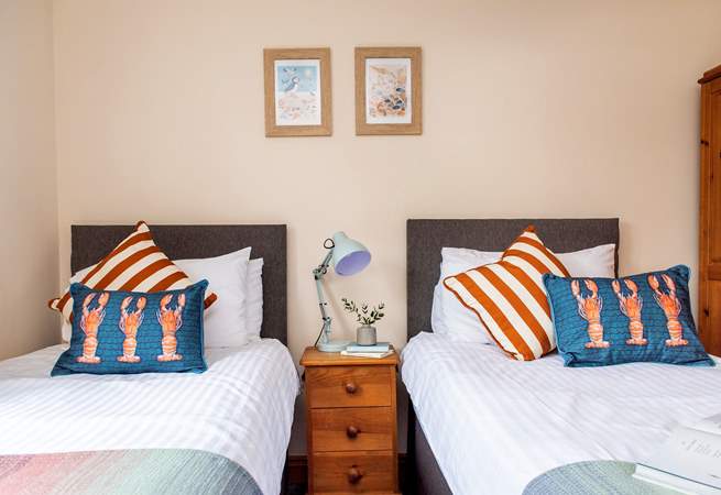 The seaside cushions and prints perfectly suit the coastal location.