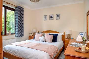 Lovely soothing shades of blue and pink in bedroom one.