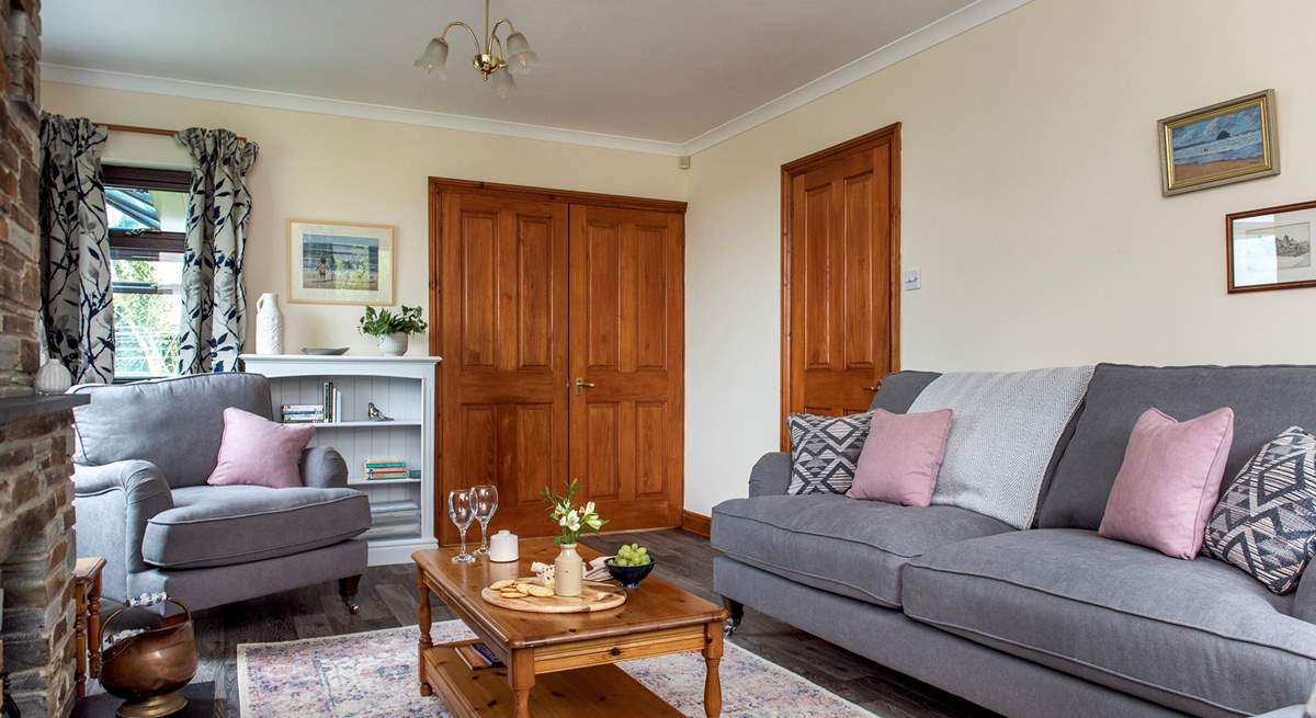 Double doors lead from the sitting-room out to the kitchen/dining-room.