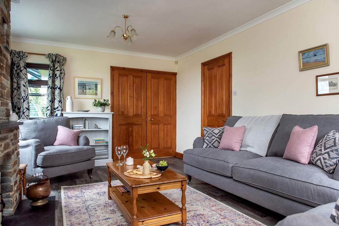 Double doors lead from the sitting-room out to the kitchen/dining-room.