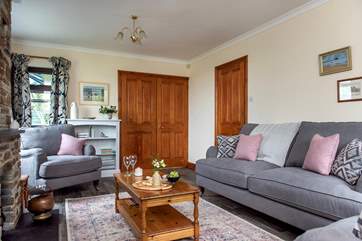 Double doors lead from the sitting-room out to the kitchen/dining-room.