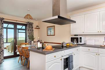 Double doors lead from the dining area out to sunny conservatory.