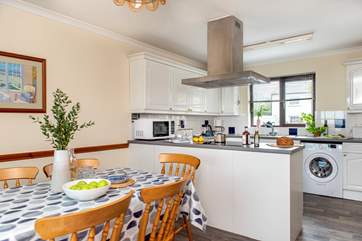 The kitchen dining room is wonderfully light and airy.