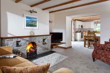 The sitting-room leads through to the kitchen/dining-room.