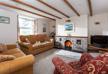 Comfortable sofas and a welcoming open fire in the sitting-area.