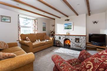 Comfortable sofas and a welcoming open fire in the sitting-area.