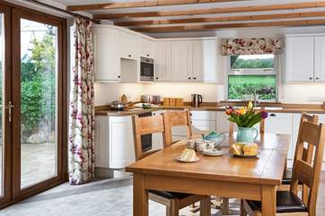 You have access to the patio and garden directly from the kitchen/dining-room.