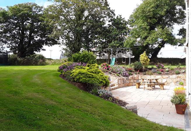The large garden has a play set for the children and plenty of space for games on the lawn too.