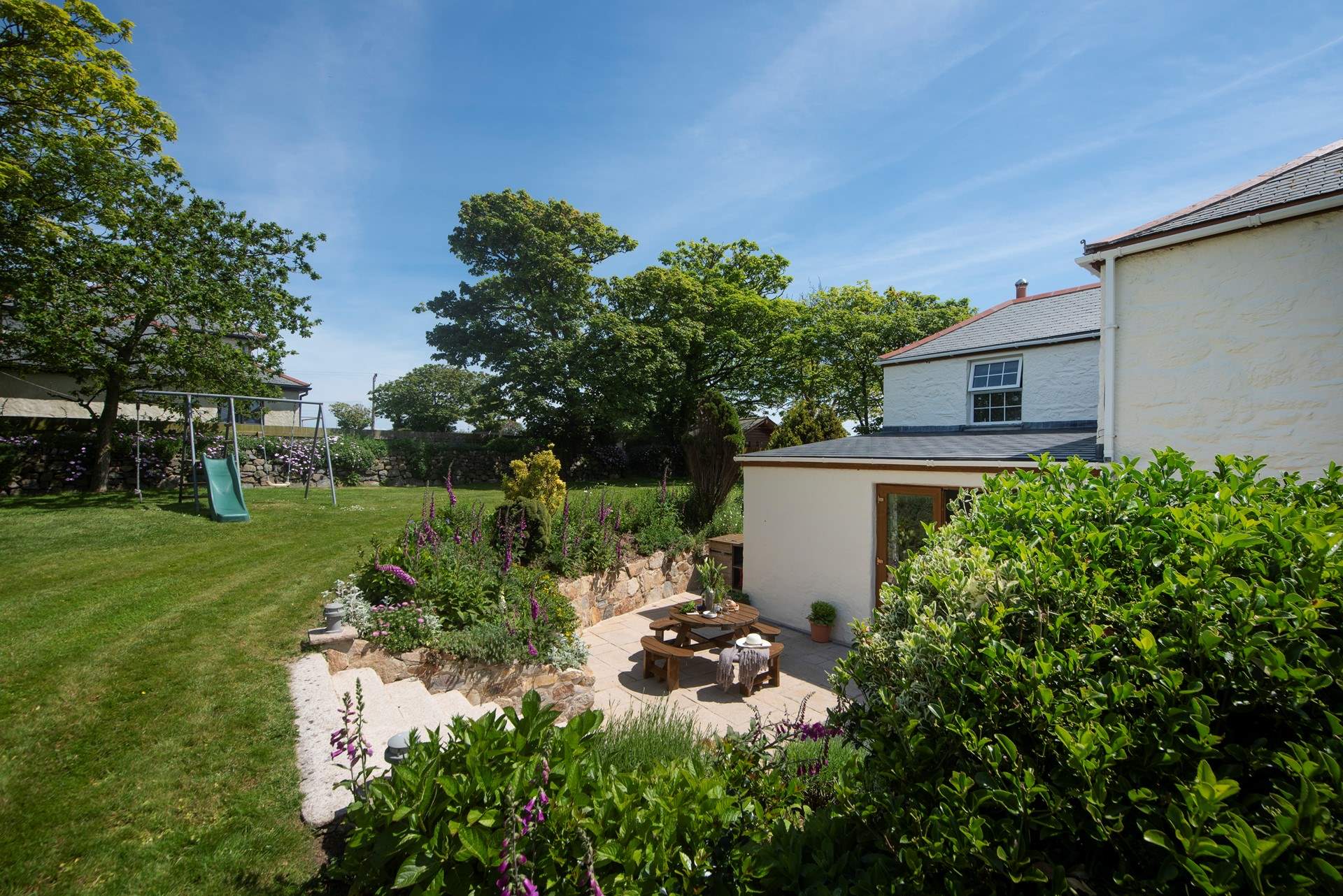 There is a lovely garden with seating and play equipment for the children to enjoy.