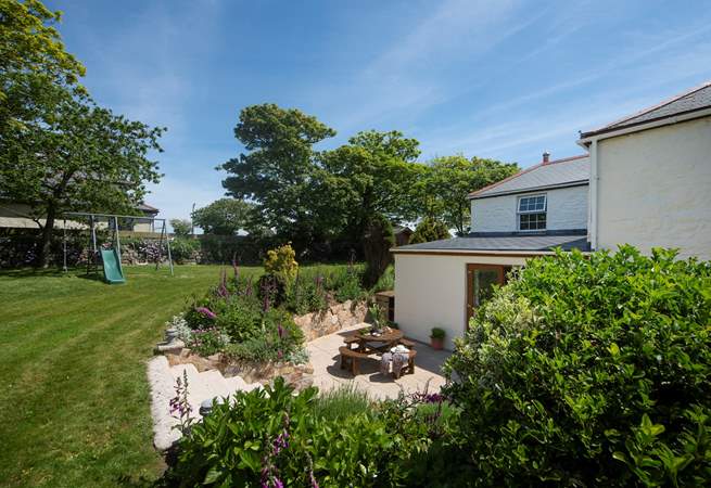 There is a lovely garden with seating and play equipment for the children to enjoy.