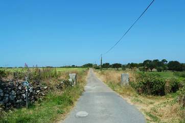 A little way back along the private road, a public footpath on the right leads to the village pub, about a fifteen minute walk away down the hill.