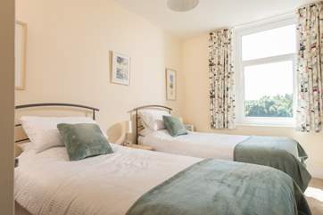The twin bedroom has seaside influences.