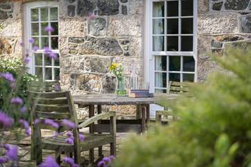 Sit a while at the front of the cottage in this tranquil location.