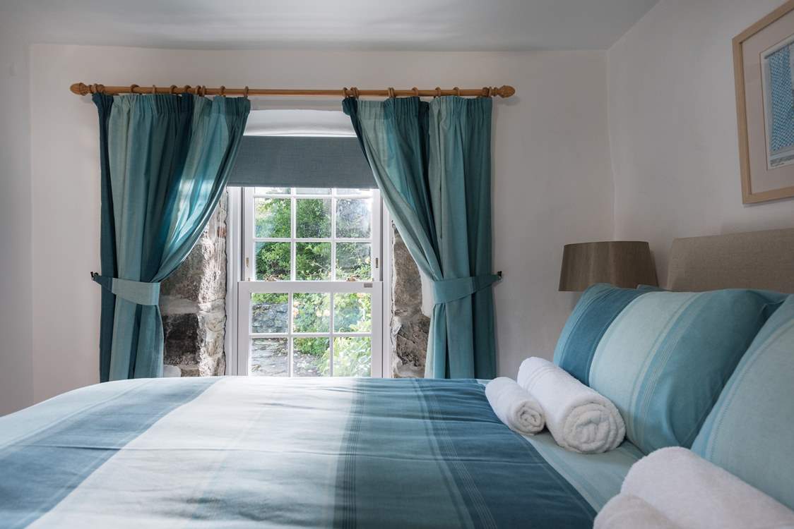 This bedroom is lovely and light.