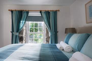 This bedroom is lovely and light.