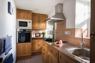 The cottage kitchen may be small but it is surprisingly well-equipped.