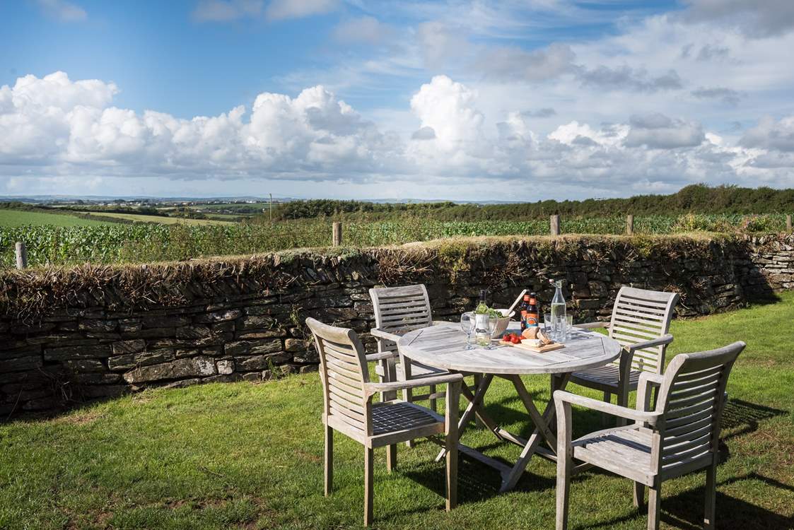 The enclosed, private back garden has wonderful far reaching views across open fields.