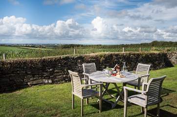 The enclosed, private back garden has wonderful far reaching views across open fields.