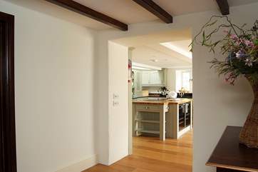 From the snug, a step up takes you into the oak-floored hall, another step leading down into the kitchen (please take care).