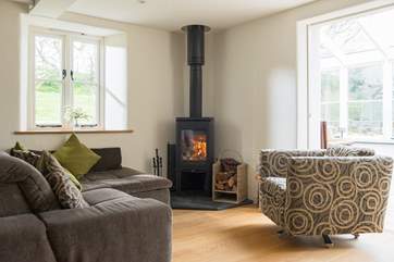 A comfy spot to sit and relax with a good book - beside the wood-burner in the sitting-area.