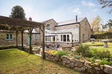 Looking back at this good looking stone cottage from the garden.