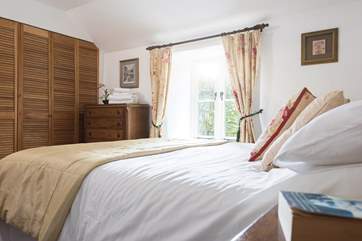 The master bedroom has lots of storage and is next door to the bathroom.