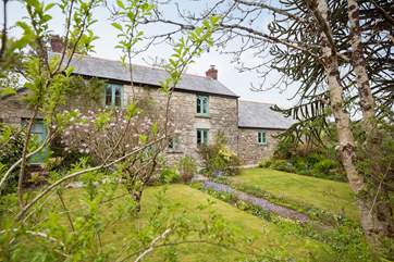 The cottage is set back from the quiet lane.