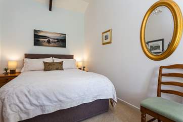 The tastefully furnished bedroom.