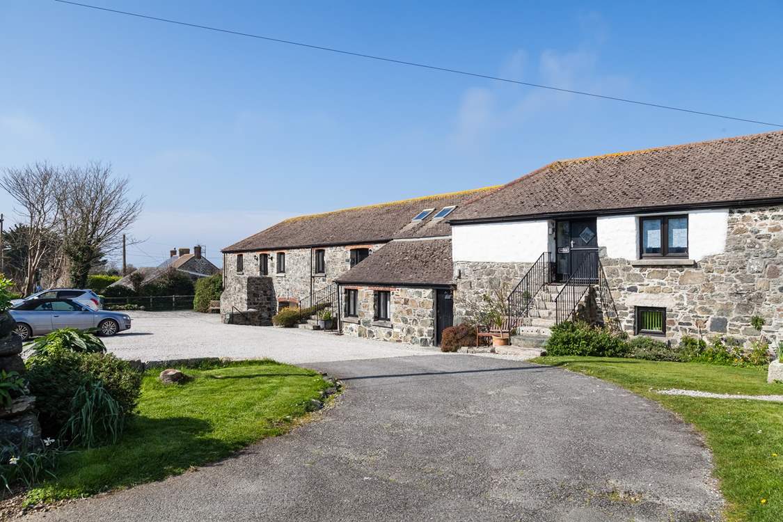 Pull in to the attractive barn conversions and park up. Kynance is accessed through the courtyard on the other side.