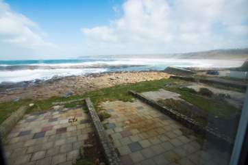 The terrace is on the edge of the sea.