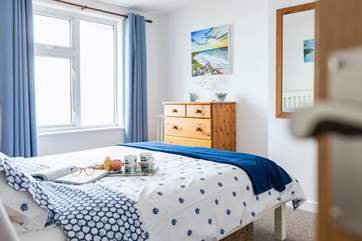 The master bedroom with a comfortable king size bed.