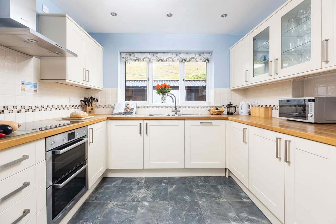 The kitchen has plenty of work-space so the family can help out with making dinner.