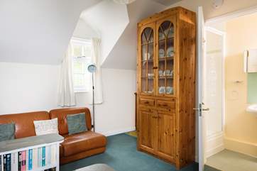 There is a little kitchen-area tucked away beside the dresser on the first floor, and a shower-room too, making this an almost self-contained floor for added independence.