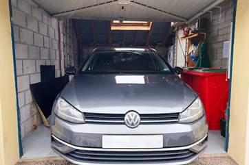 The garage fits a medium sized car (such as a golf).