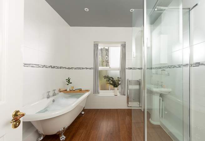 The family bathroom on the lower ground floor has a fabulous free standing bath and separate shower.
