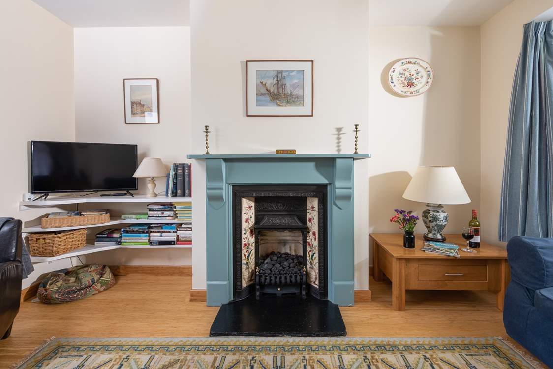 The coal-effect fire will keep you cosy in cooler months.