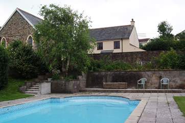 Orchard Dene is the cottage in the background. The gated steps lead down to the pool from a really large and private sun-trap patio behind the wall.