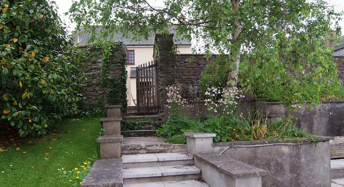 The steps from the pool up to the cottage. The gate is at the top.