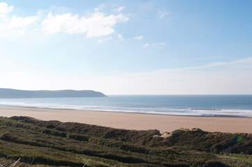 The owners even provide you with a car parking permit for the Putsborough Beach car park. Miles of golden sand and surfing at the Woolacombe end to the right.