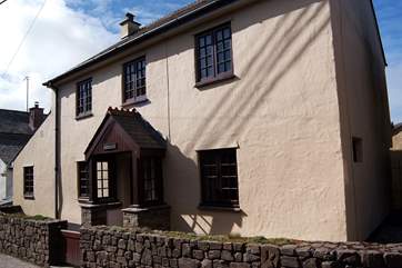 The cottage fronts onto the little village road, parking is to the left-hand side, and from there you can go straight through to the patio.