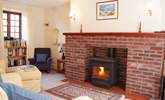 This lovely cosy sitting-room has a multi-burner for any cooler evenings. - Thumbnail Image