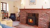 This lovely cosy sitting-room has a multi-burner for any cooler evenings.