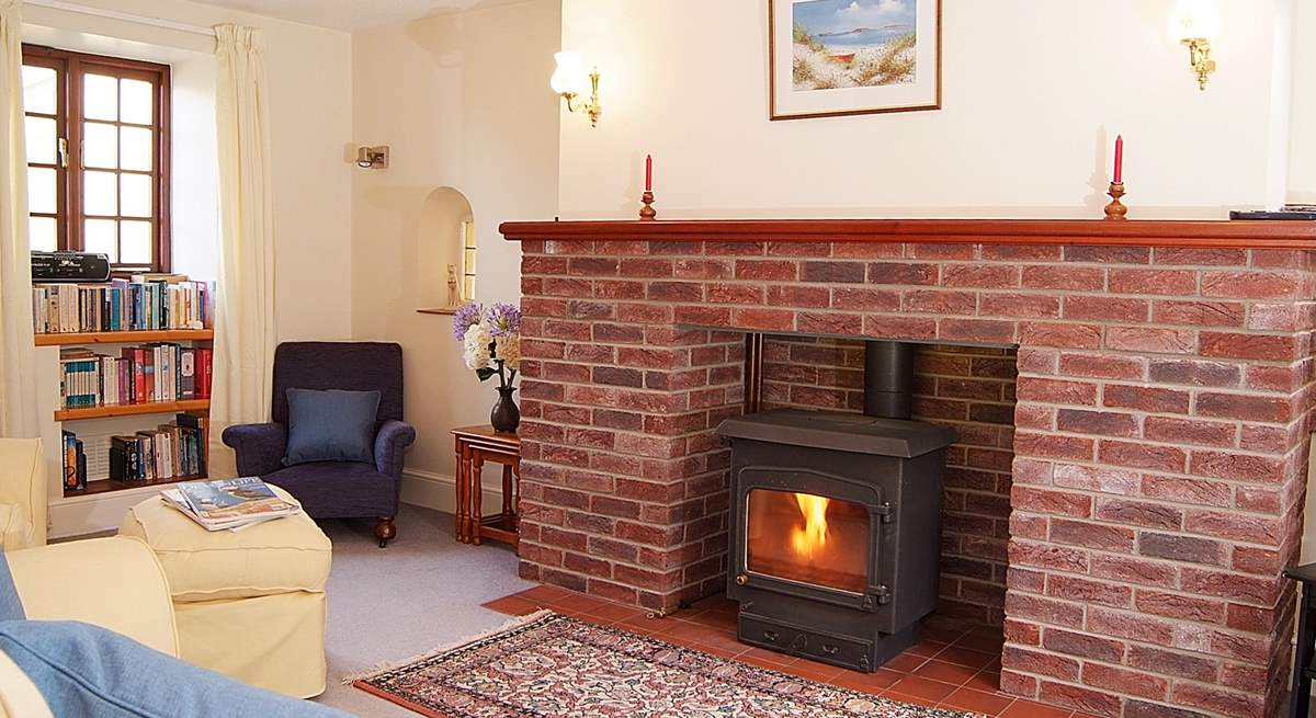 This lovely cosy sitting-room has a multi-burner for any cooler evenings.