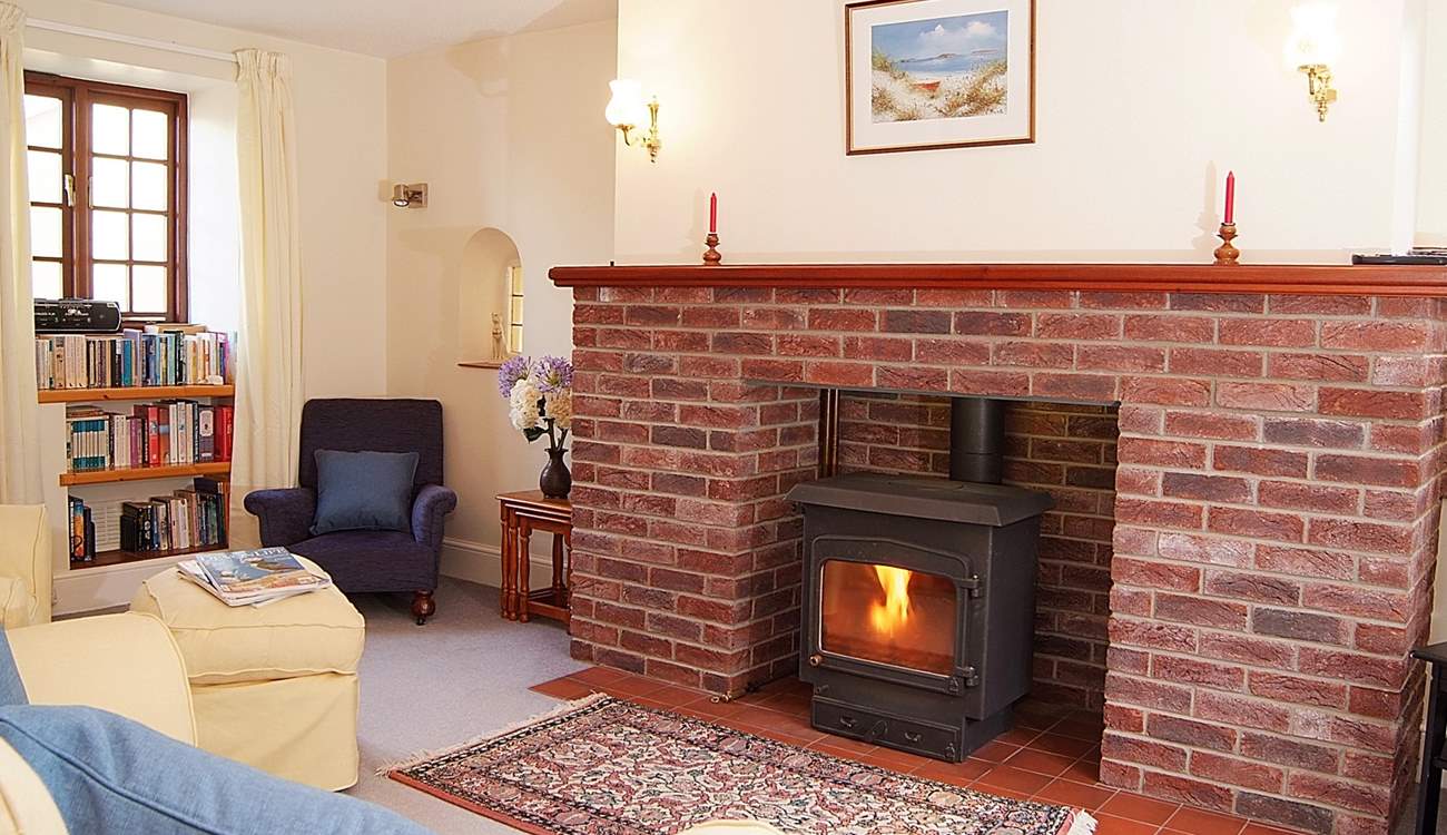 This lovely cosy sitting-room has a multi-burner for any cooler evenings.
