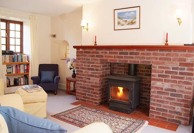 This lovely cosy sitting-room has a multi-burner for any cooler evenings.