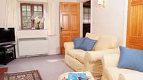 The sitting-room with its comfy sofa and chairs.